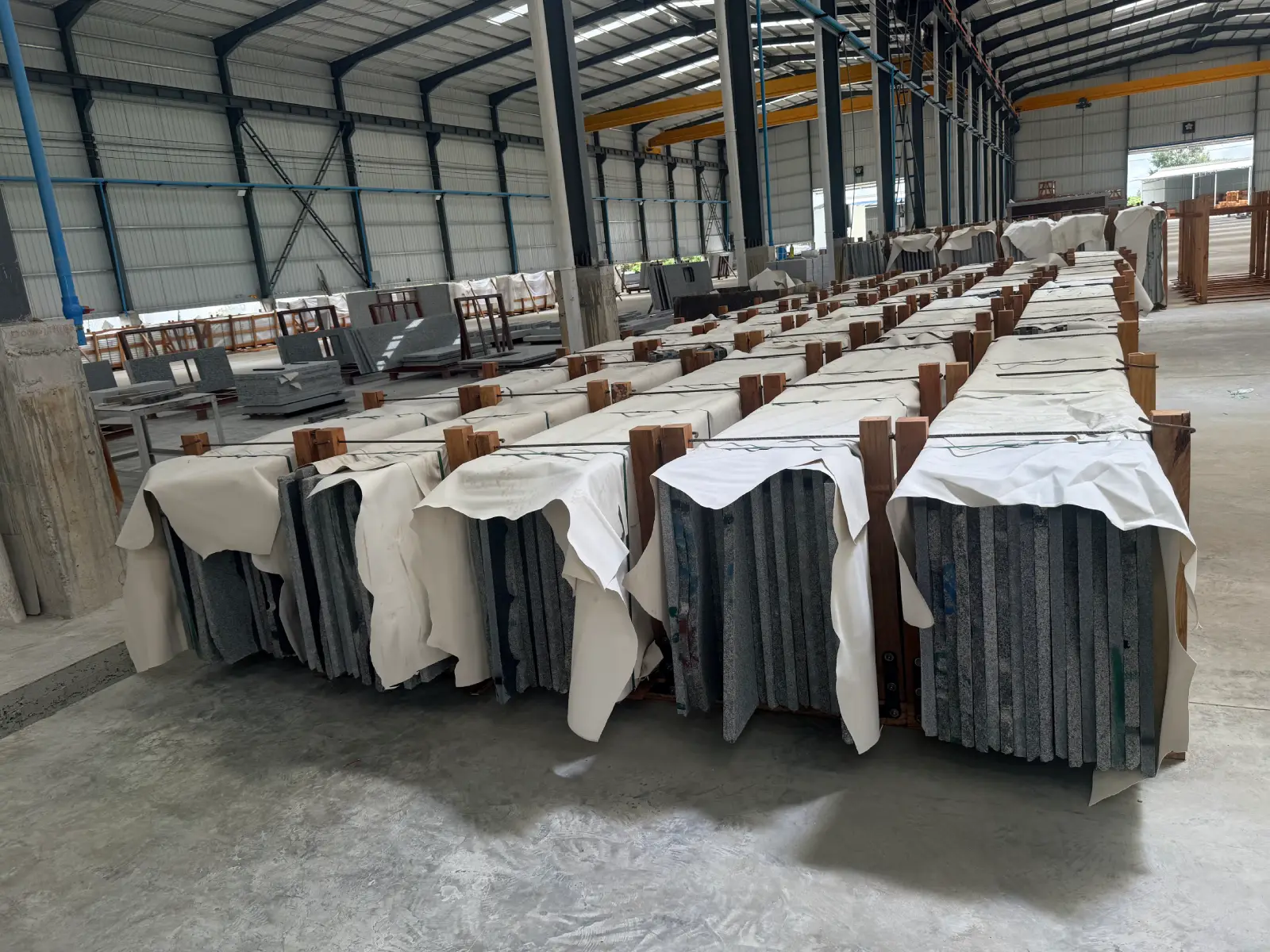 Cambodia Granite Slab Stock Cambodia granite slabs arranged in stone yard