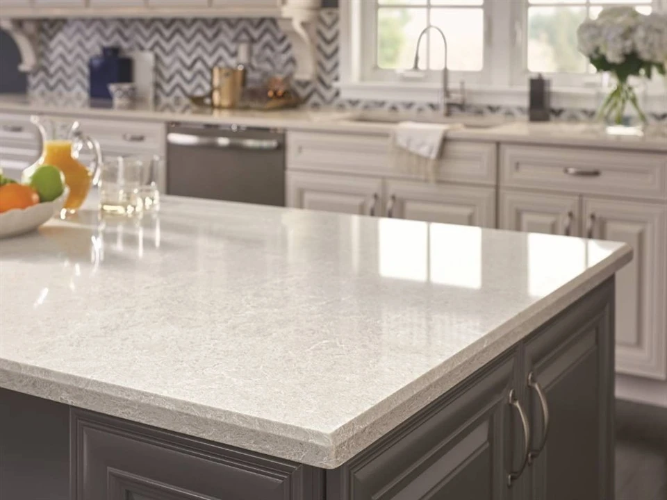 Engineered quartz kitchen island showing a beveled front edge Engineered quartz kitchen island showing a beveled front edge