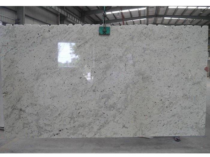 Large Andromeda White granite slab inspected in the workshop Large Andromeda White granite slab inspected in the workshop