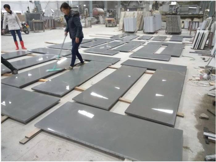Grey quartz countertop pieces arranged during project inspection Grey quartz countertop pieces arranged during project inspection